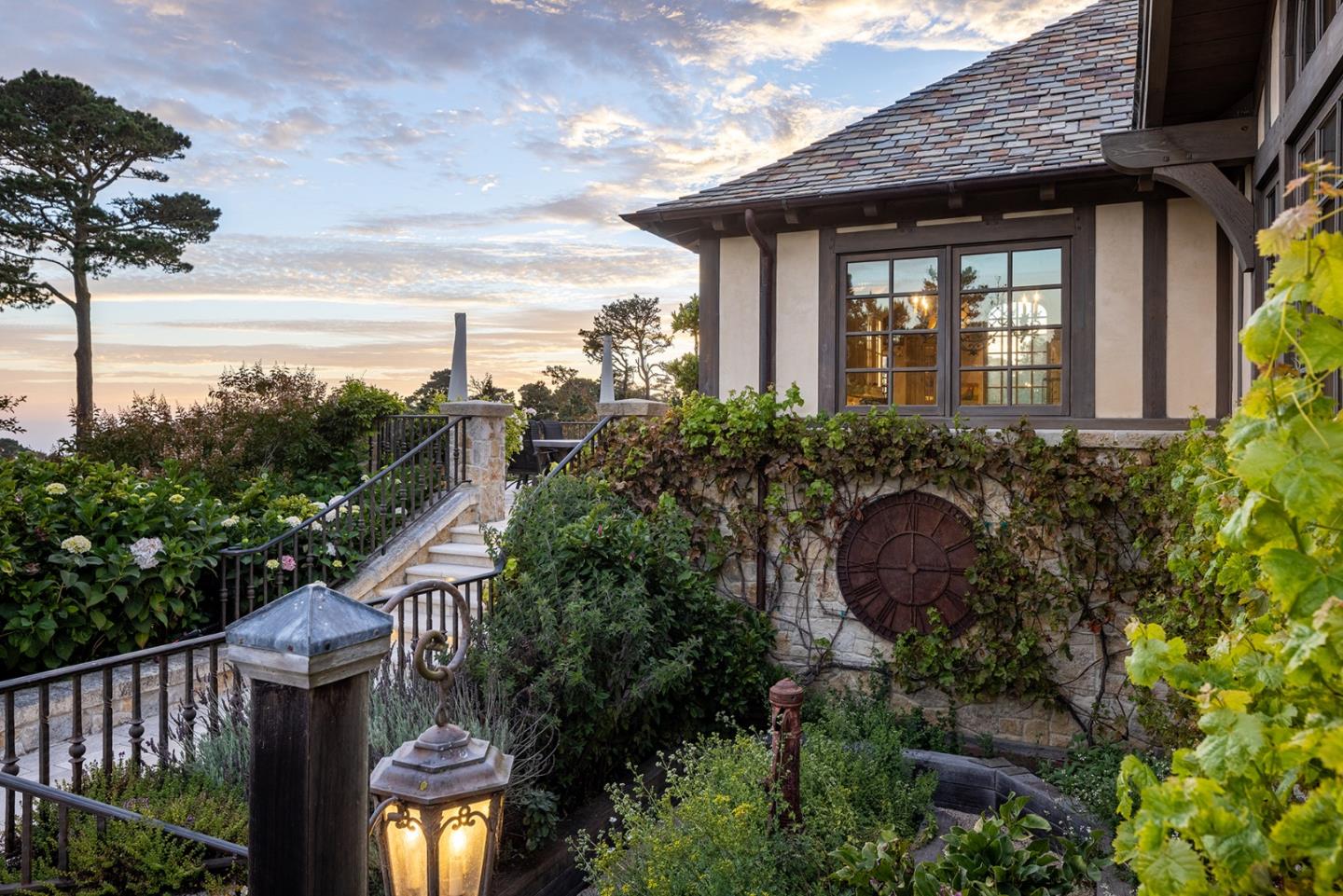 2 La Pradera Carmel, CA 93923 - Photo 26 of 42 a front view of a house with a yard and potted plants