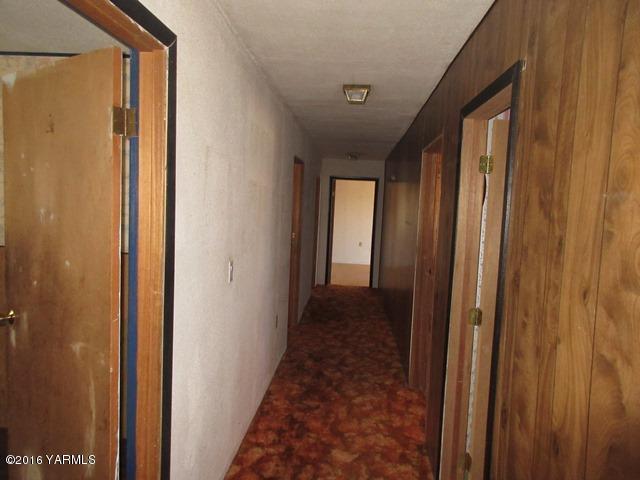 270 Evans Road Wapato, WA 98951 - Photo 11 of 42 a view of a hallway with a wooden door