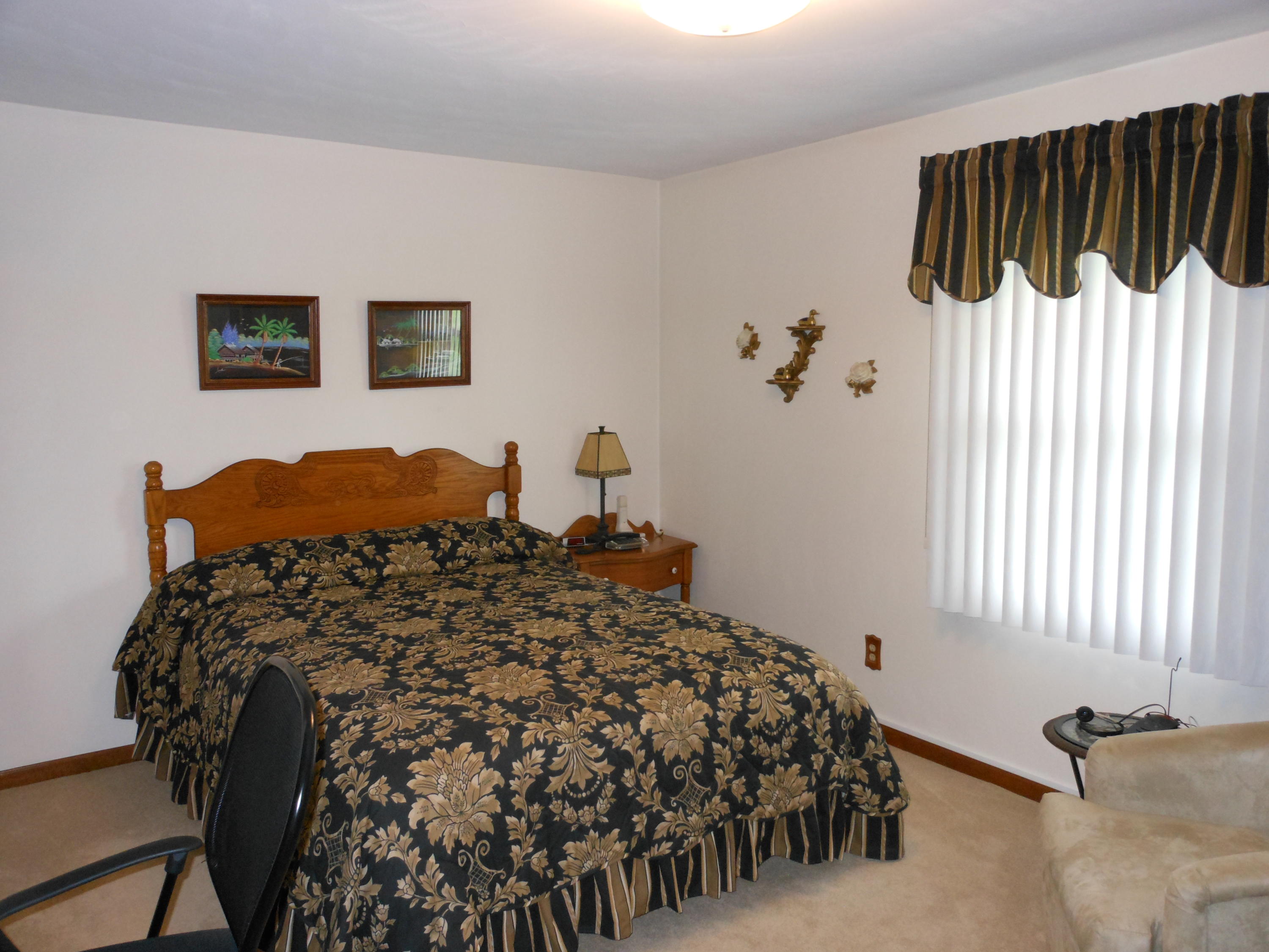 2767 Rutrough Road Southeast Roanoke, VA 24014 - Photo 14 of 36 a bedroom with a bed and a window