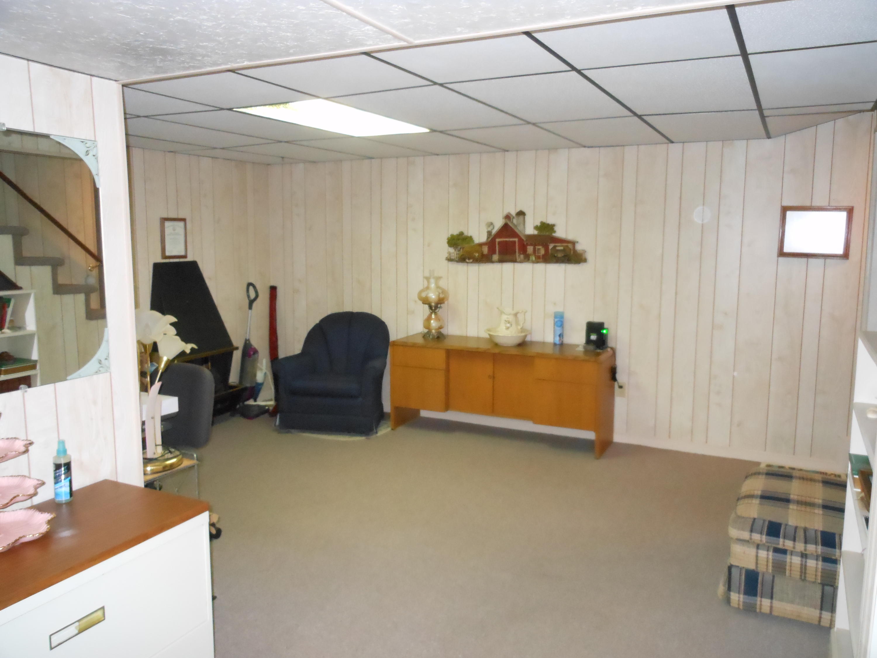 2767 Rutrough Road Southeast Roanoke, VA 24014 - Photo 21 of 36 a living room with furniture and a flat screen tv