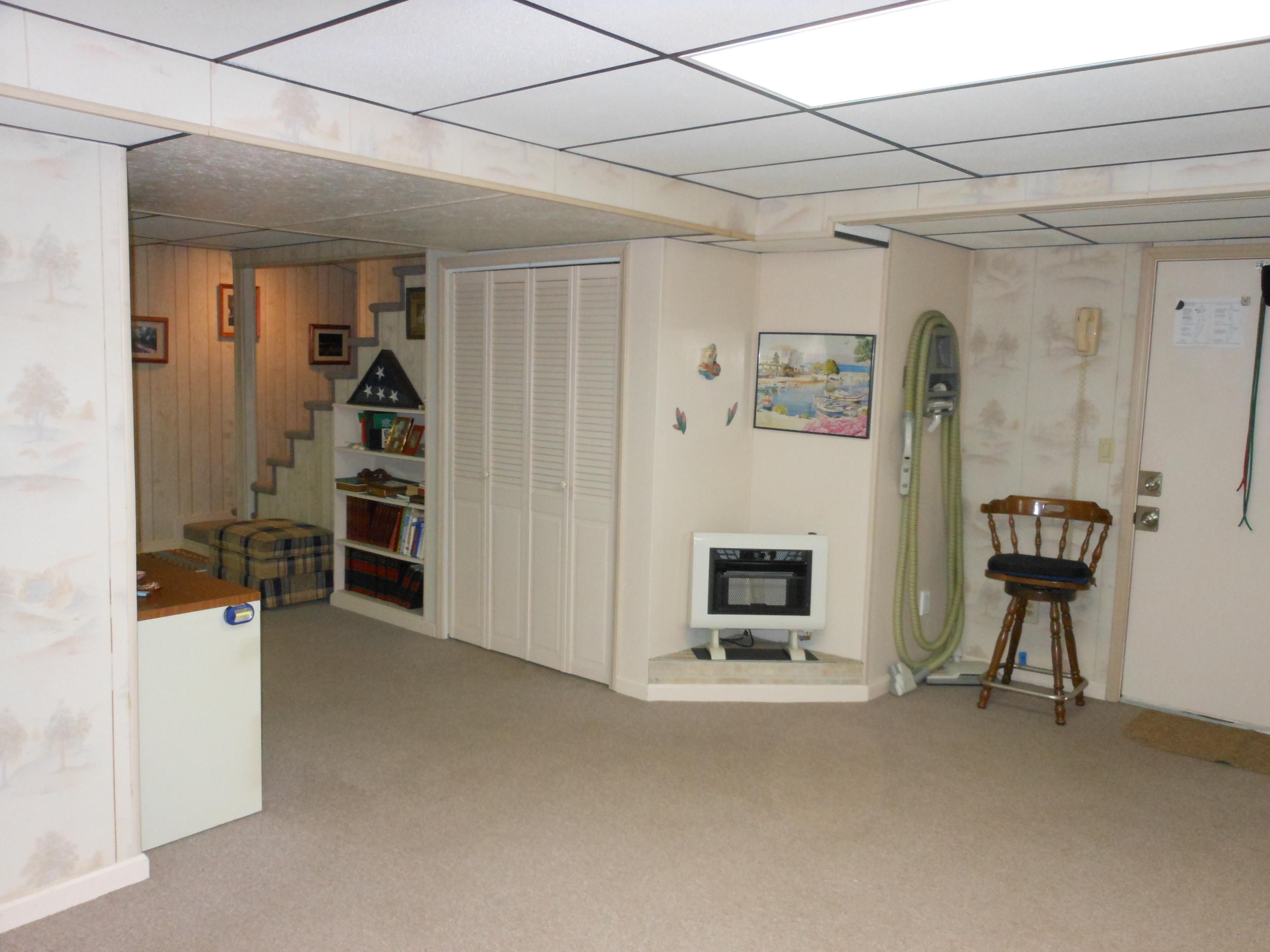 2767 Rutrough Road Southeast Roanoke, VA 24014 - Photo 22 of 36 a view of a livingroom with furniture and a ceiling fan