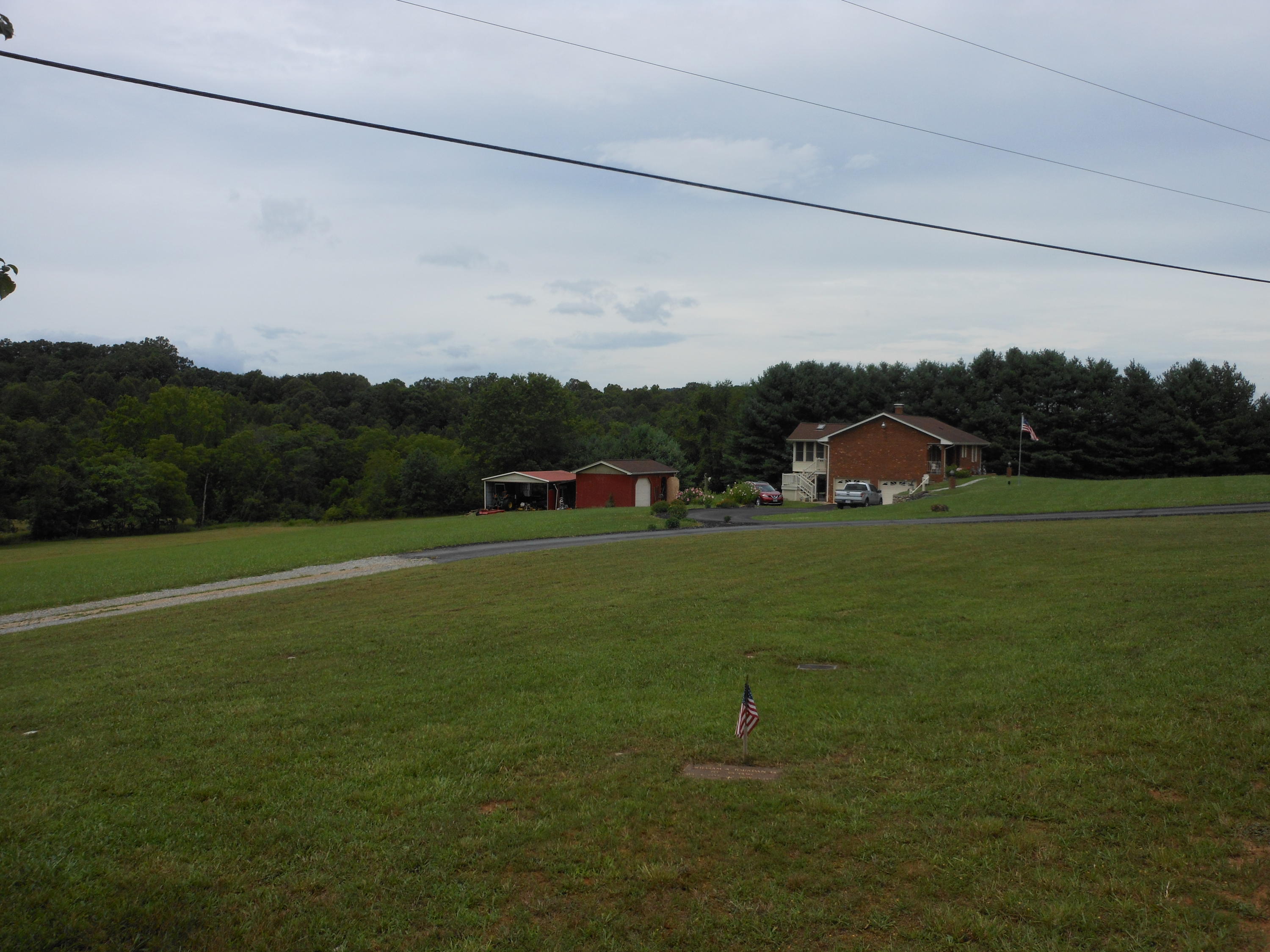 2767 Rutrough Road Southeast Roanoke, VA 24014 - Photo 28 of 36 a view of a green field with mountains in the background