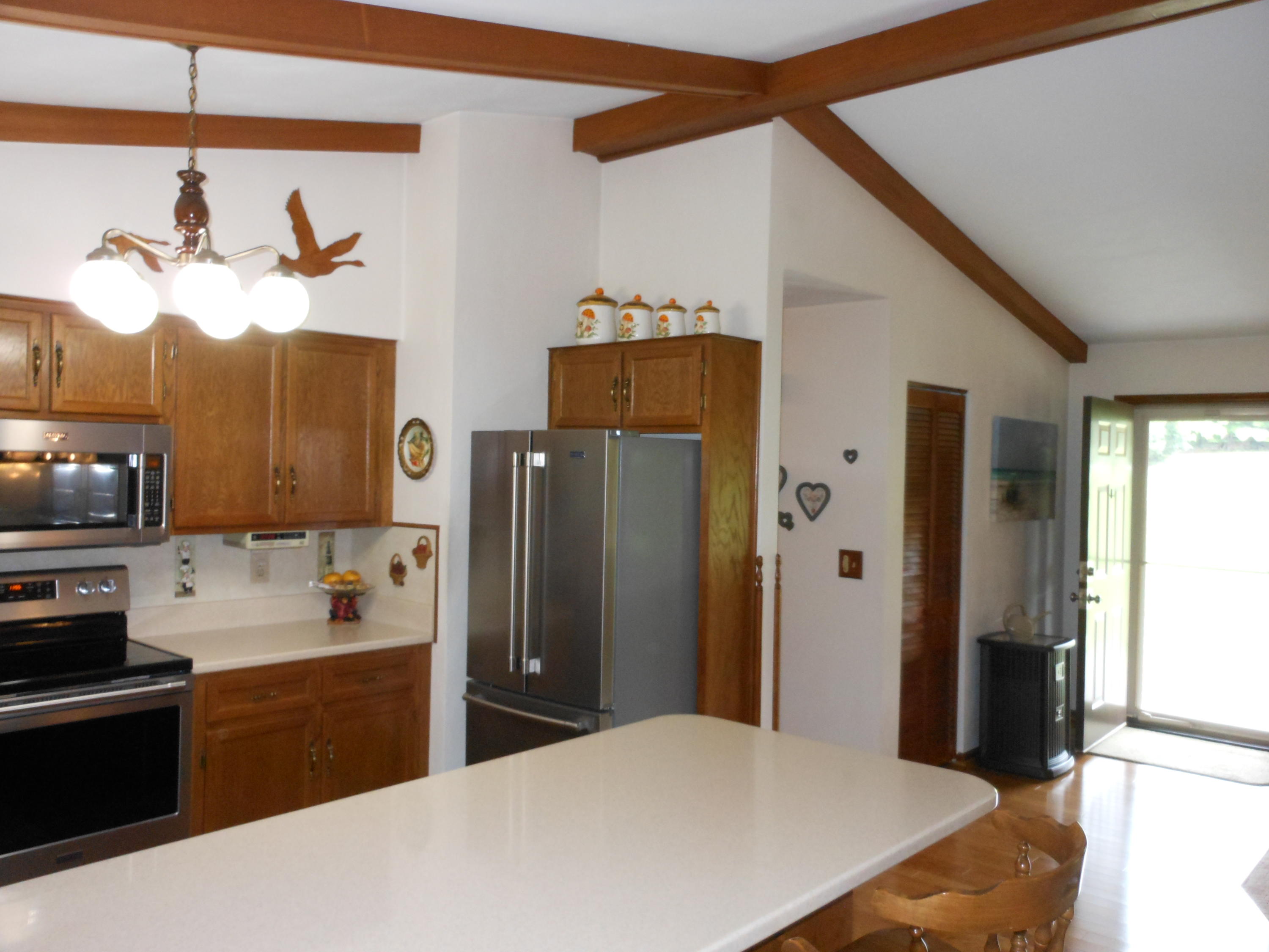 2767 Rutrough Road Southeast Roanoke, VA 24014 - Photo 6 of 36 a kitchen with a refrigerator and a sink