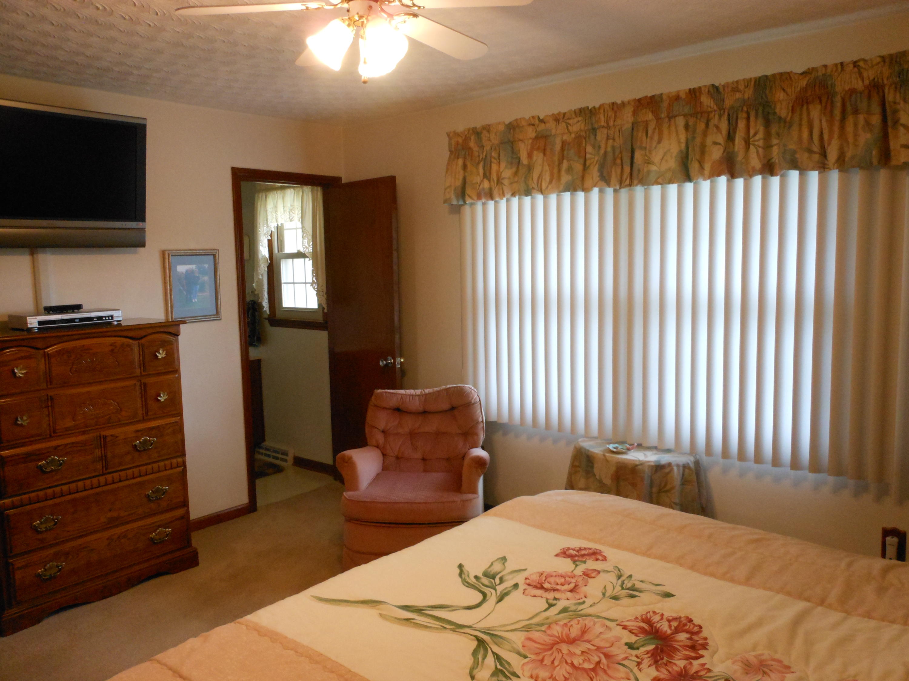 2767 Rutrough Road Southeast Roanoke, VA 24014 - Photo 10 of 36 a bedroom with a bed and a television