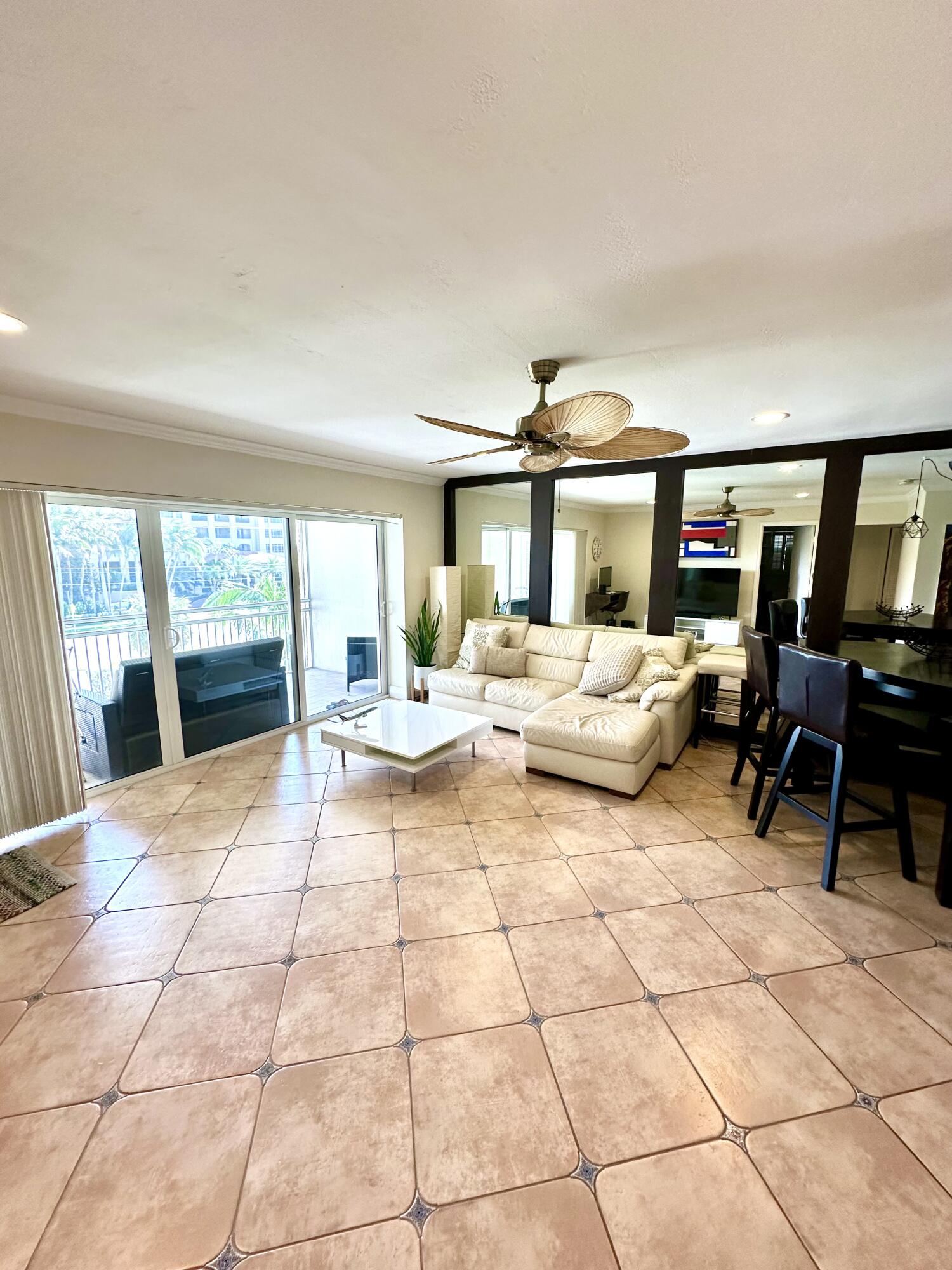 2501 South Ocean Boulevard, Unit 3040 Boca Raton, FL 33432 - Photo 2 of 22 a living room with furniture and a large window