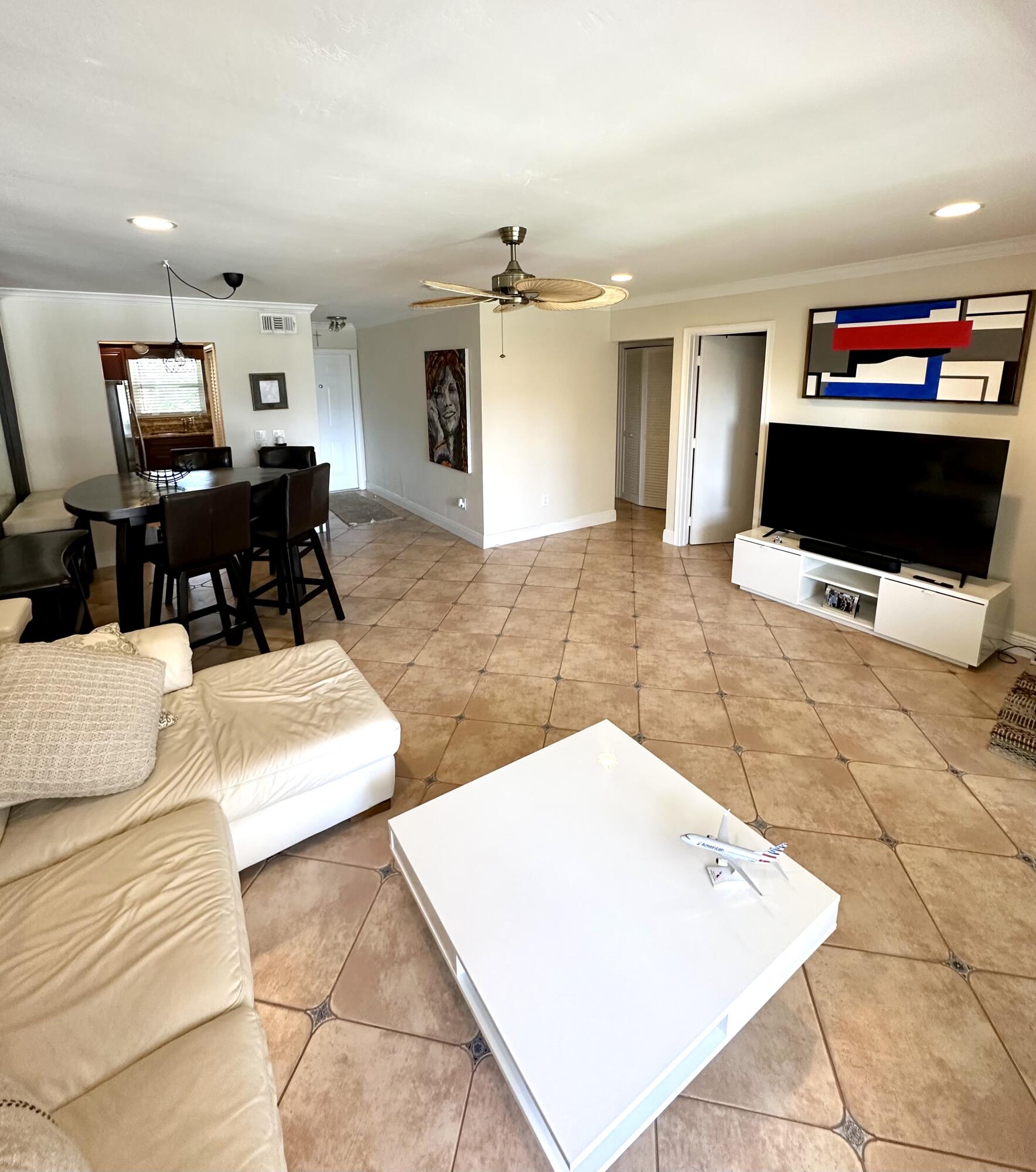 2501 South Ocean Boulevard, Unit 3040 Boca Raton, FL 33432 - Photo 4 of 22 a living room with furniture and a flat screen tv