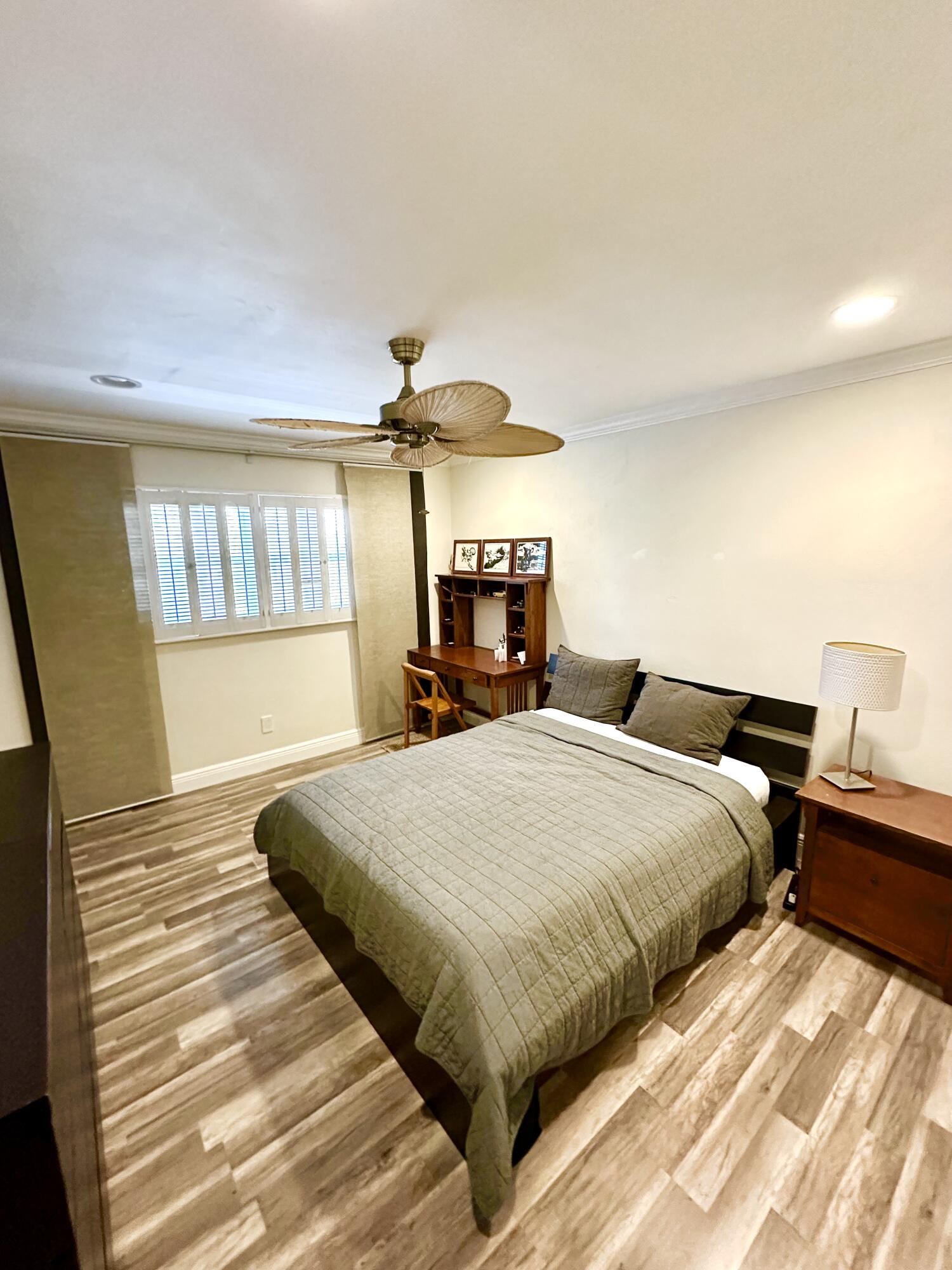 2501 South Ocean Boulevard, Unit 3040 Boca Raton, FL 33432 - Photo 8 of 22 a bedroom with double bed and a chandelier