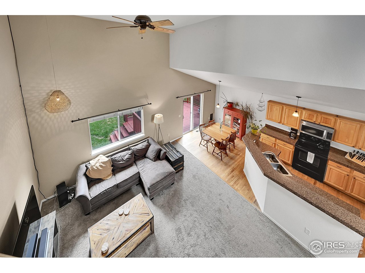 514 Peyton Drive Fort Collins, CO 80525 - Photo 15 of 40 a living room with furniture and a flat screen tv