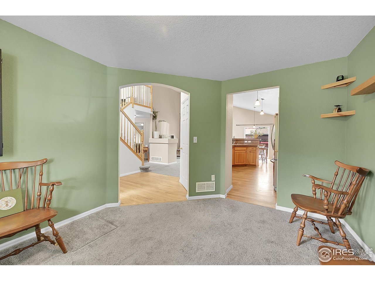 514 Peyton Drive Fort Collins, CO 80525 - Photo 17 of 40 a workspace with furniture and wooden floor