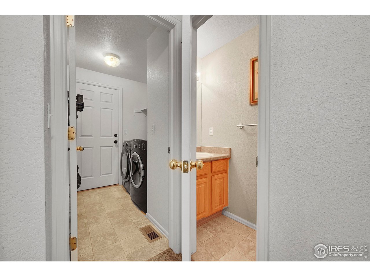 514 Peyton Drive Fort Collins, CO 80525 - Photo 18 of 40 a view of a storage & utility room with a sink