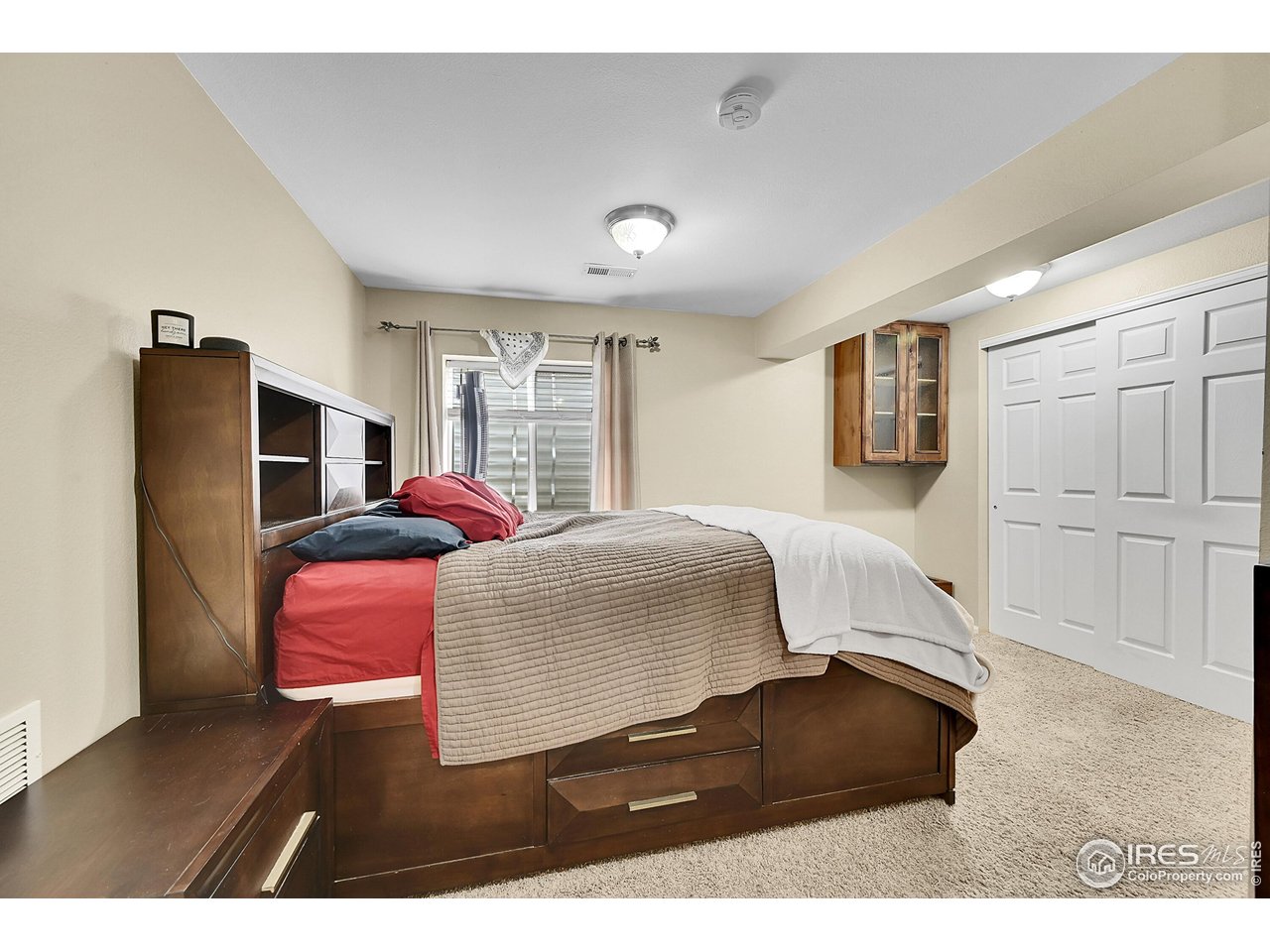 514 Peyton Drive Fort Collins, CO 80525 - Photo 31 of 40 a bedroom with a bed and window
