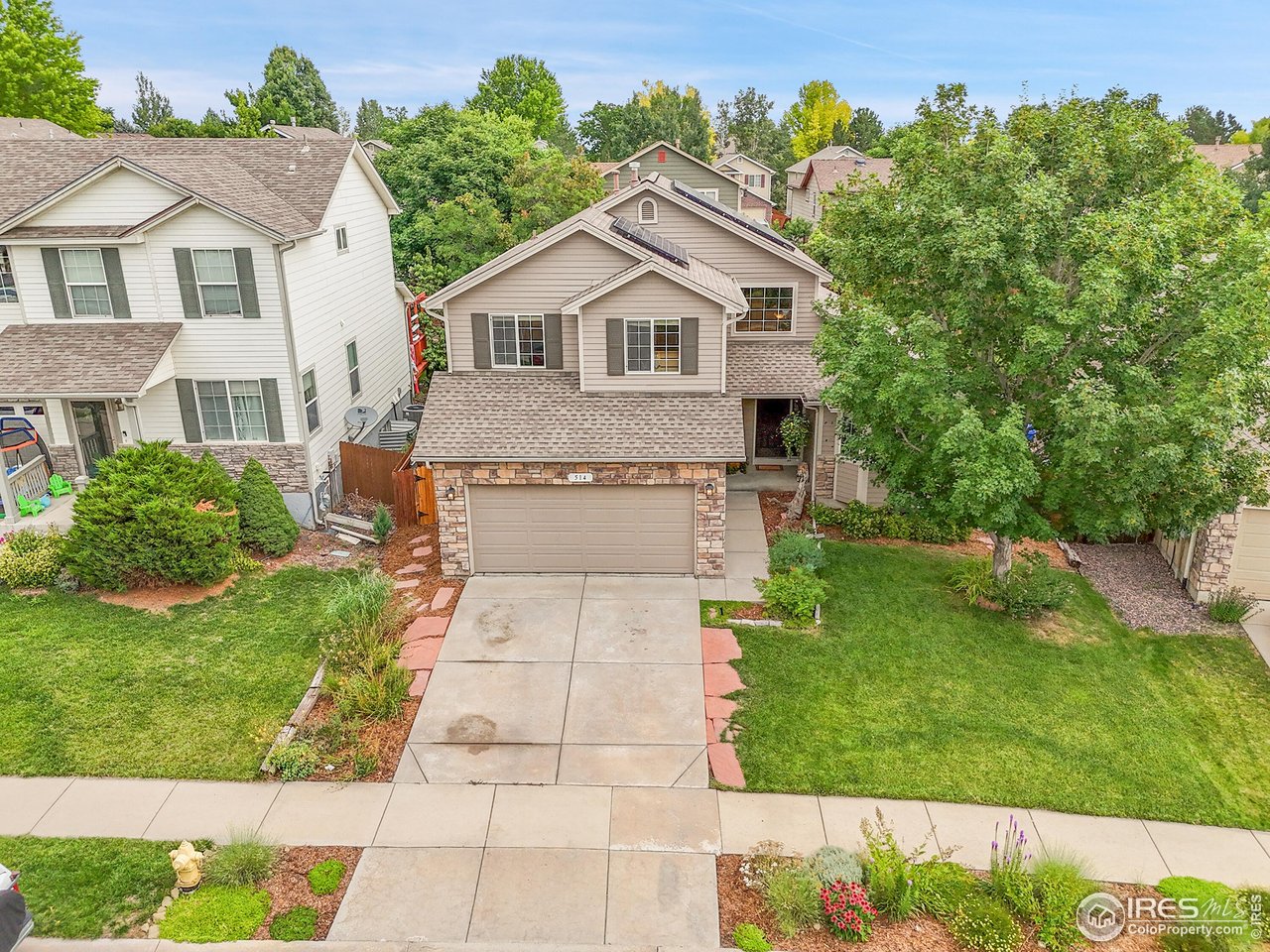 514 Peyton Drive Fort Collins, CO 80525 - Photo 37 of 40 a front view of a house with a yard