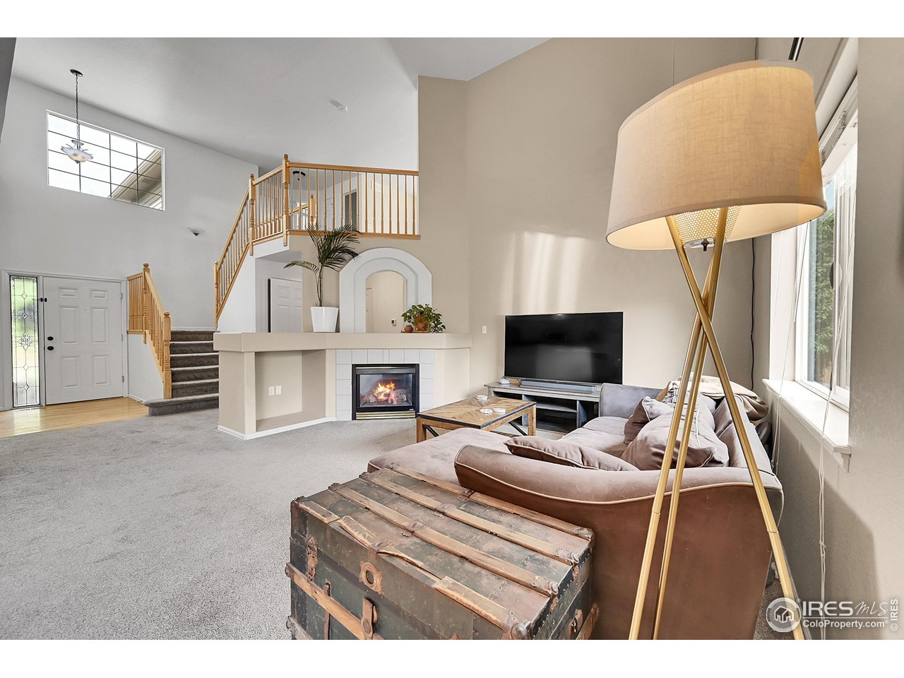 514 Peyton Drive Fort Collins, CO 80525 - Photo 5 of 40 a living room with furniture and a flat screen tv