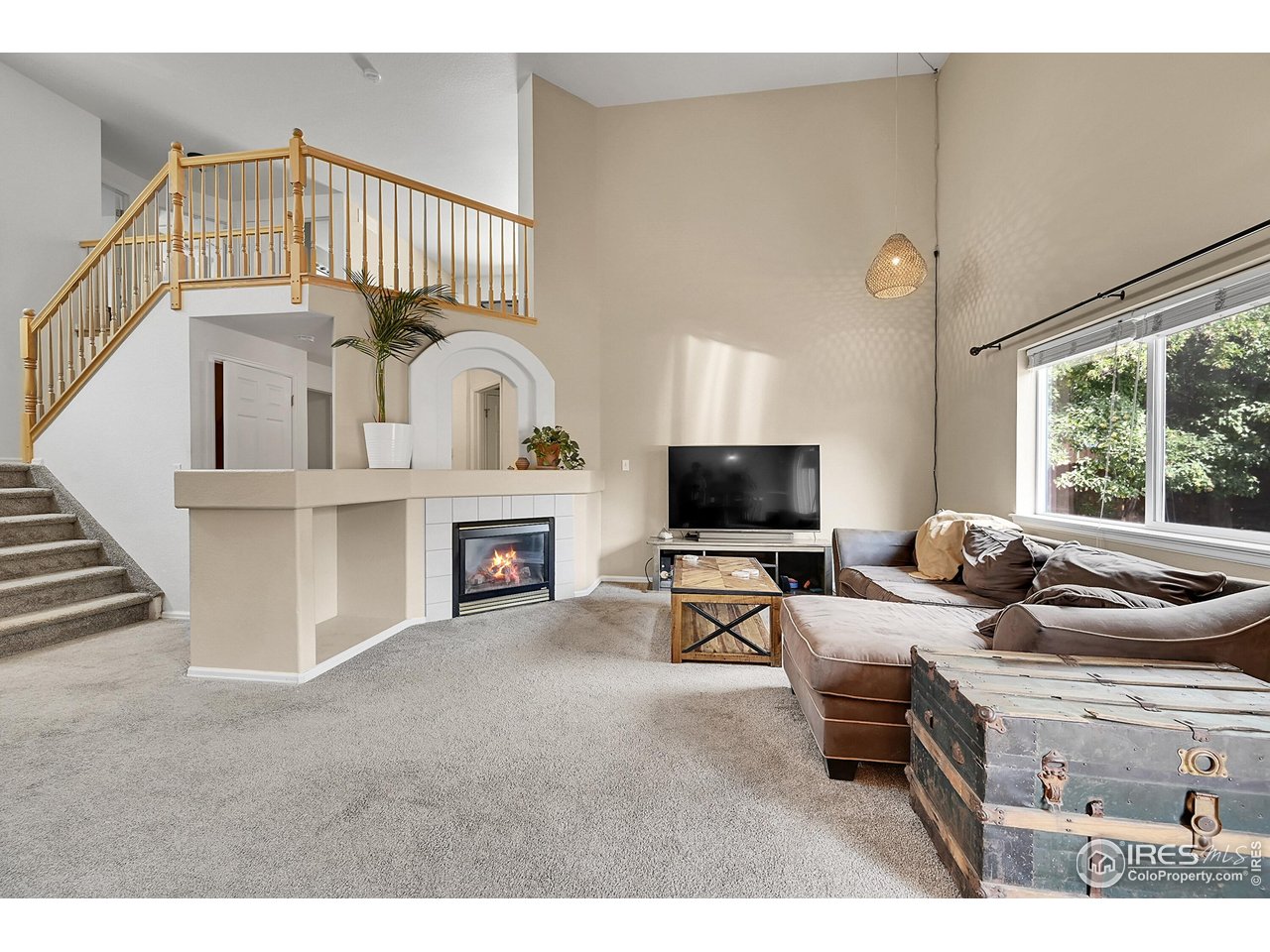 514 Peyton Drive Fort Collins, CO 80525 - Photo 6 of 40 a living room with furniture and a flat screen tv