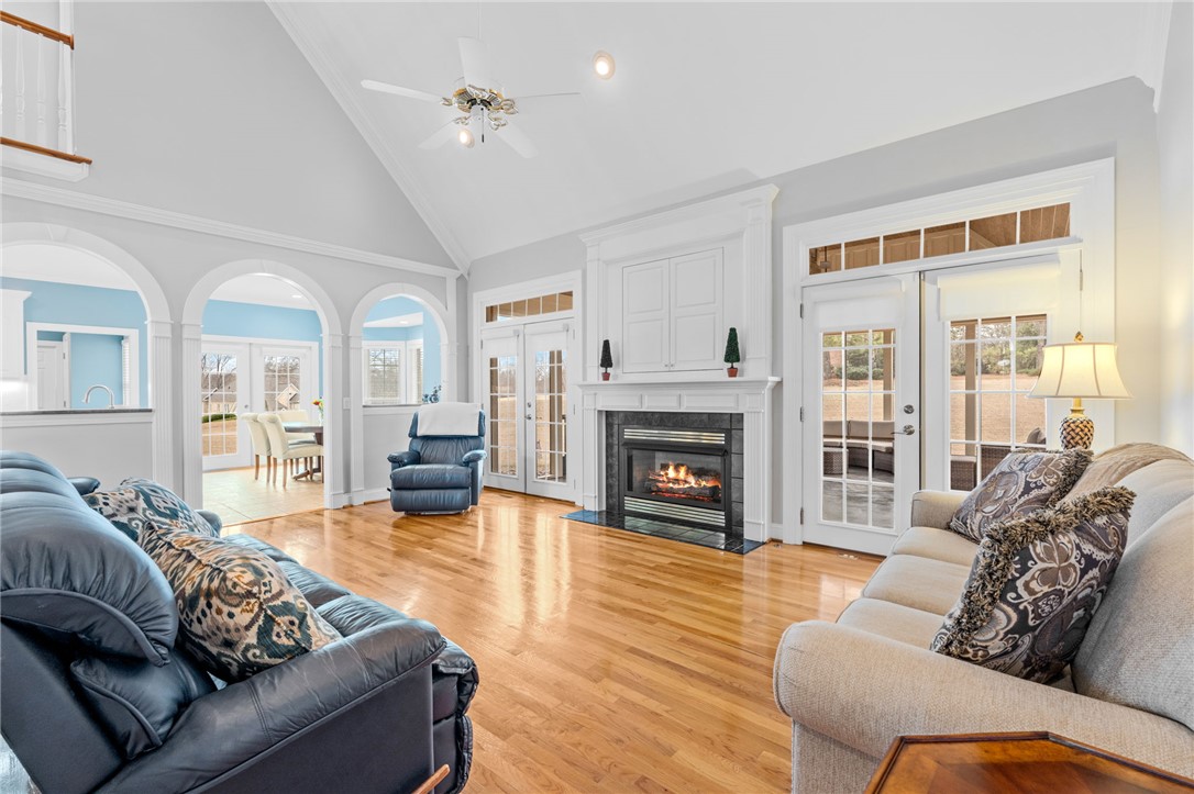 100 Farm Terrace Court Easley, SC 29642 - Photo 14 of 47 This airy living space features soaring ceilings, a cozy fireplace, and abundant natural light.