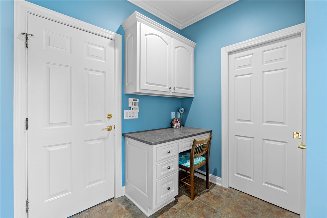 100 Farm Terrace Court Easley, SC 29642 - Photo 23 of 47 This organized utility area features ample storage and a practical workstation for everyday tasks.