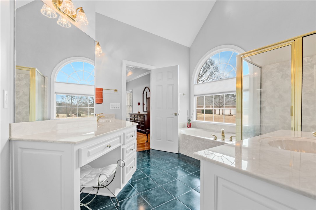 100 Farm Terrace Court Easley, SC 29642 - Photo 28 of 47 This spacious bathroom offers abundant natural light and elegant finishes for a luxurious retreat.