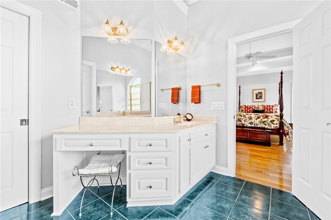 100 Farm Terrace Court Easley, SC 29642 - Photo 29 of 47 This spacious bathroom offers a double vanity and seamless access to the adjacent bedroom.