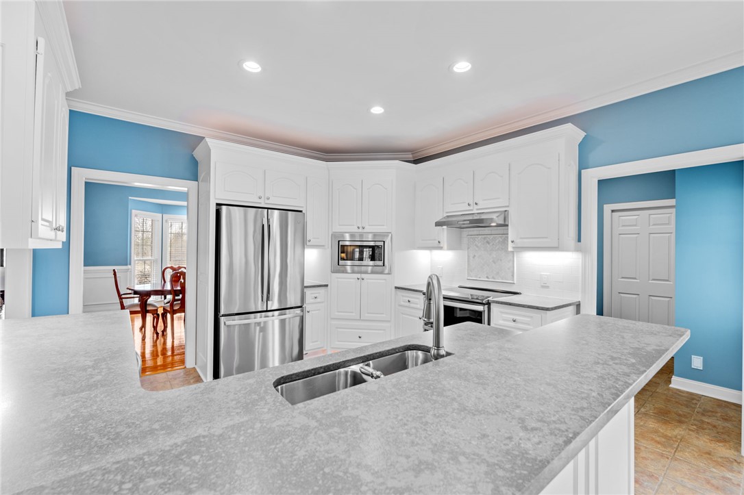 100 Farm Terrace Court Easley, SC 29642 - Photo 3 of 47 This bright kitchen features modern appliances, ample counter space, and a functional layout.