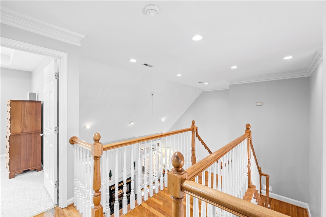 100 Farm Terrace Court Easley, SC 29642 - Photo 31 of 47 This bright hallway connects spaces with elegant wood flooring and a classic staircase.