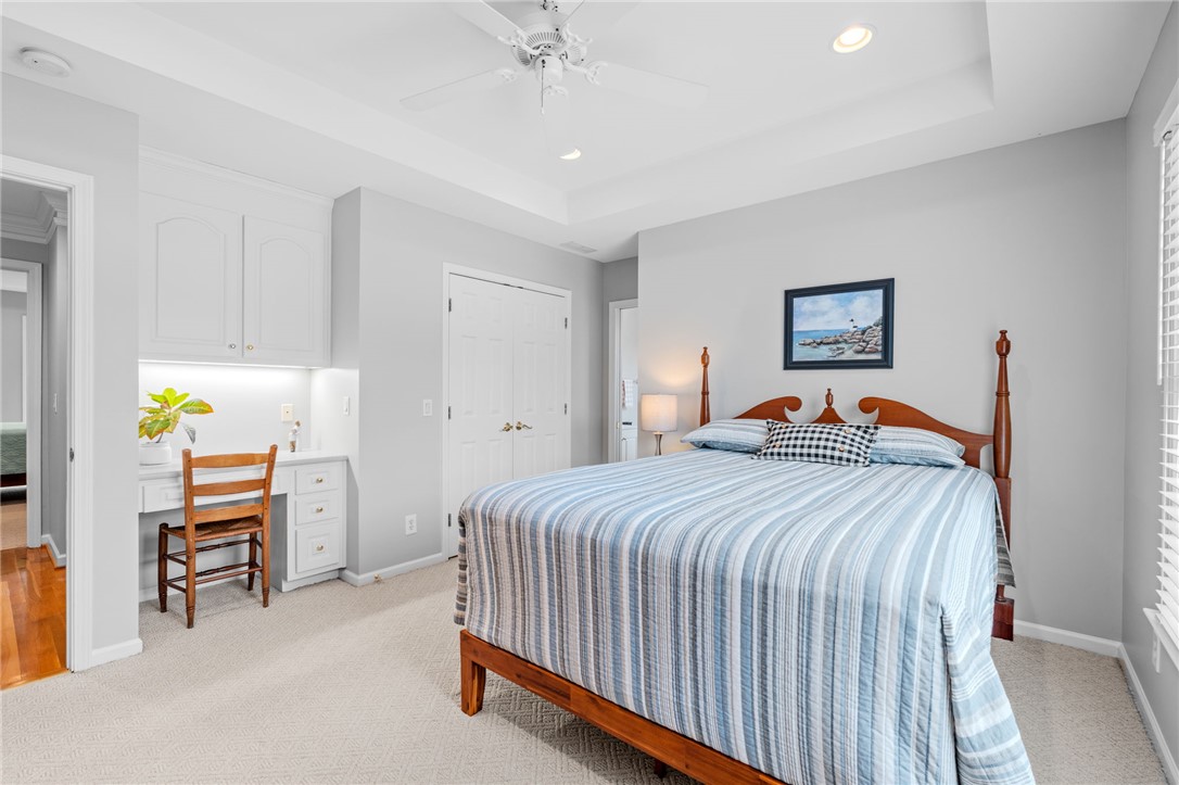 100 Farm Terrace Court Easley, SC 29642 - Photo 33 of 47 This serene bedroom offers built-in convenience and comfort for relaxation.
