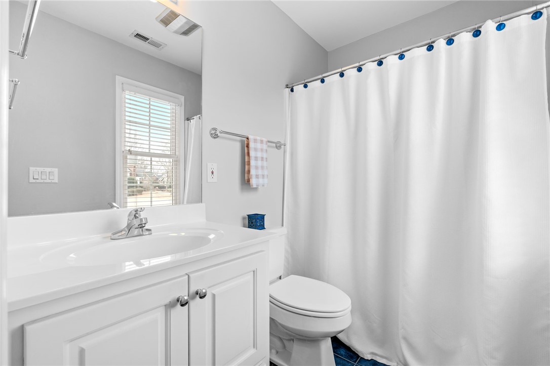 100 Farm Terrace Court Easley, SC 29642 - Photo 34 of 47 This bright bathroom features a spacious vanity with ample storage and a window for natural light.