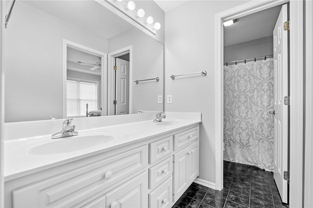 100 Farm Terrace Court Easley, SC 29642 - Photo 36 of 47 This bathroom features a double vanity and sleek modern design elements.