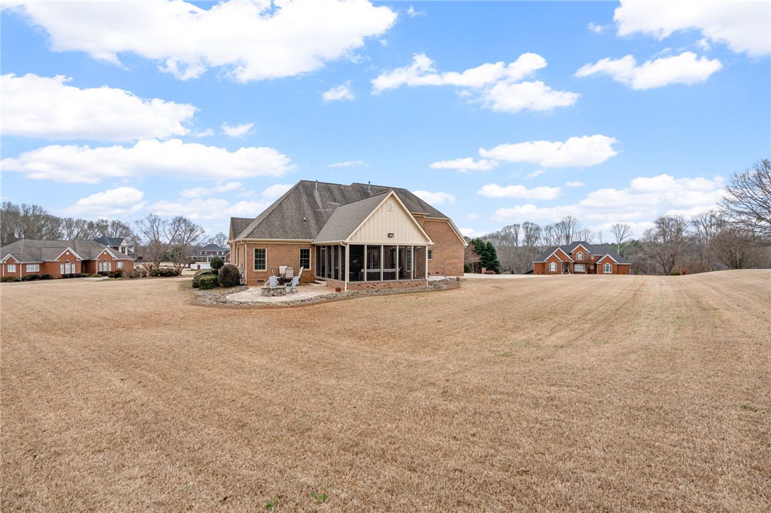 100 Farm Terrace Court Easley, SC 29642 - Photo 42 of 47 This spacious property features a charming brick exterior and a vast, open yard.