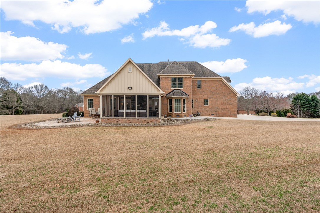 100 Farm Terrace Court Easley, SC 29642 - Photo 43 of 47 This spacious property features a charming screened porch and an expansive, well-maintained lawn.