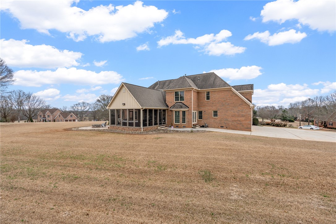 100 Farm Terrace Court Easley, SC 29642 - Photo 44 of 47 This spacious brick home features a screened porch and ample outdoor living space.