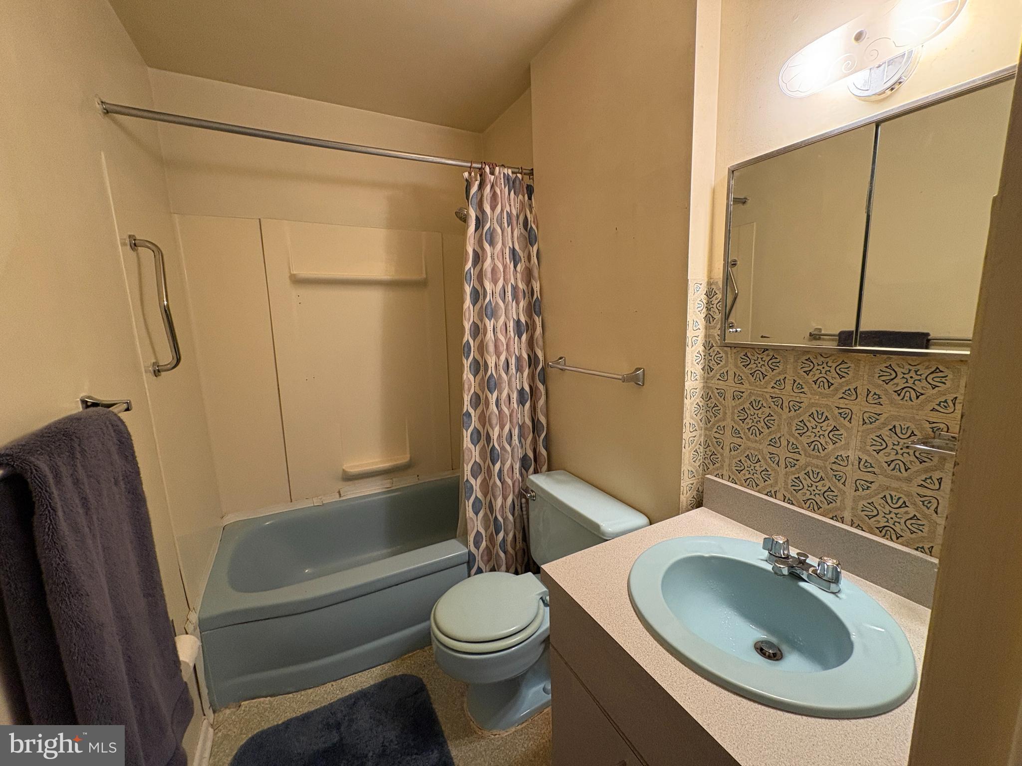 63 Gerard Road Hamilton, NJ 08620 - Photo 15 of 19 a bathroom with a sink a toilet and shower