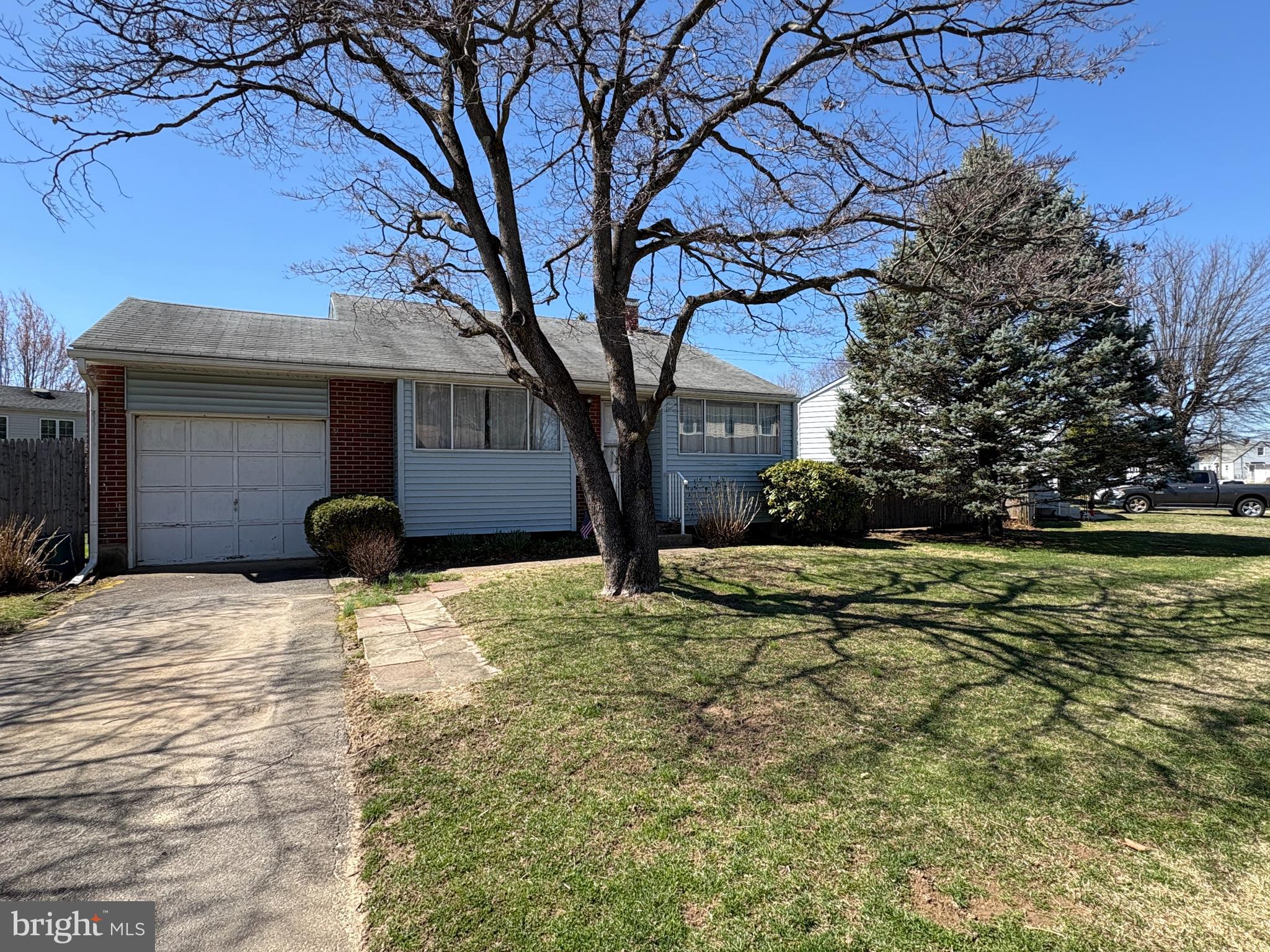 63 Gerard Road Hamilton, NJ 08620 - Photo 2 of 19 a tree in front of a white house