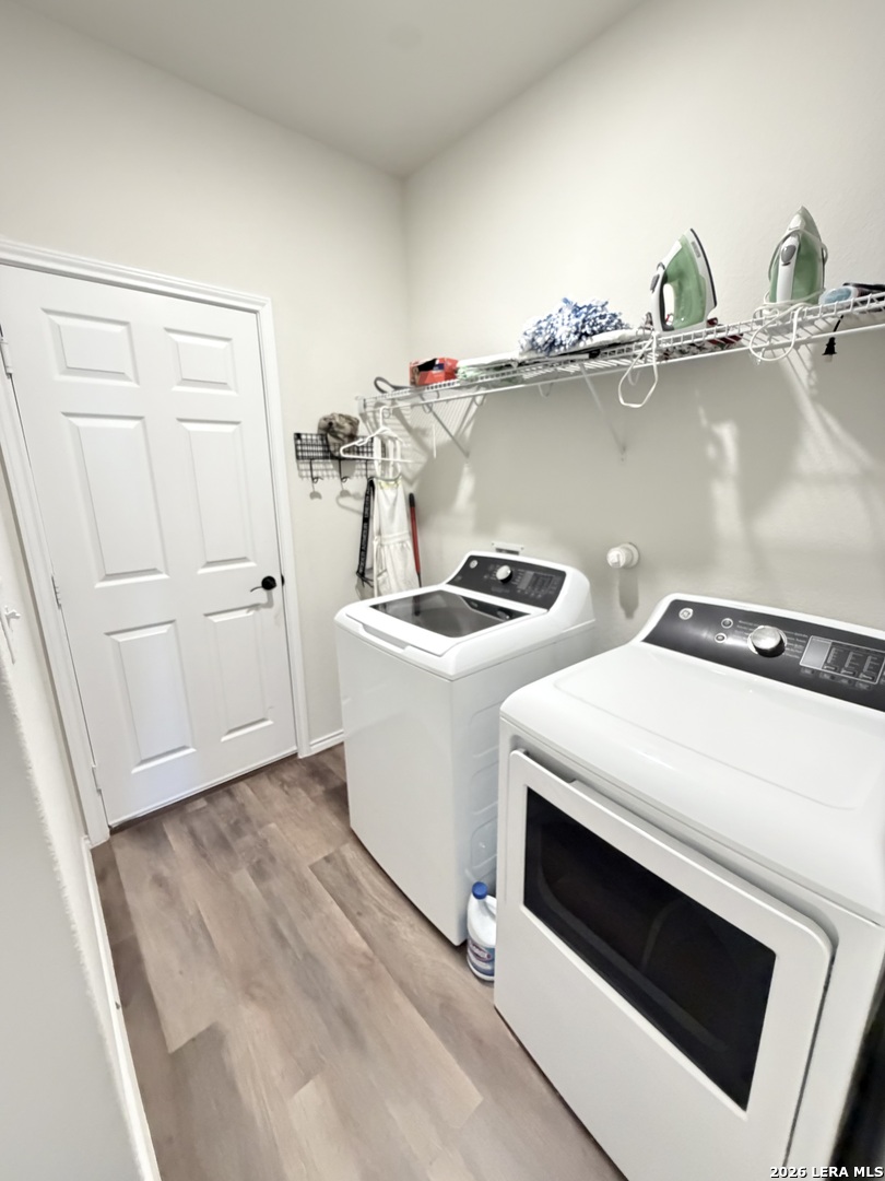 10255 Crossbuck Converse, TX 78109 - Photo 17 of 19 a utility room with dryer and washer