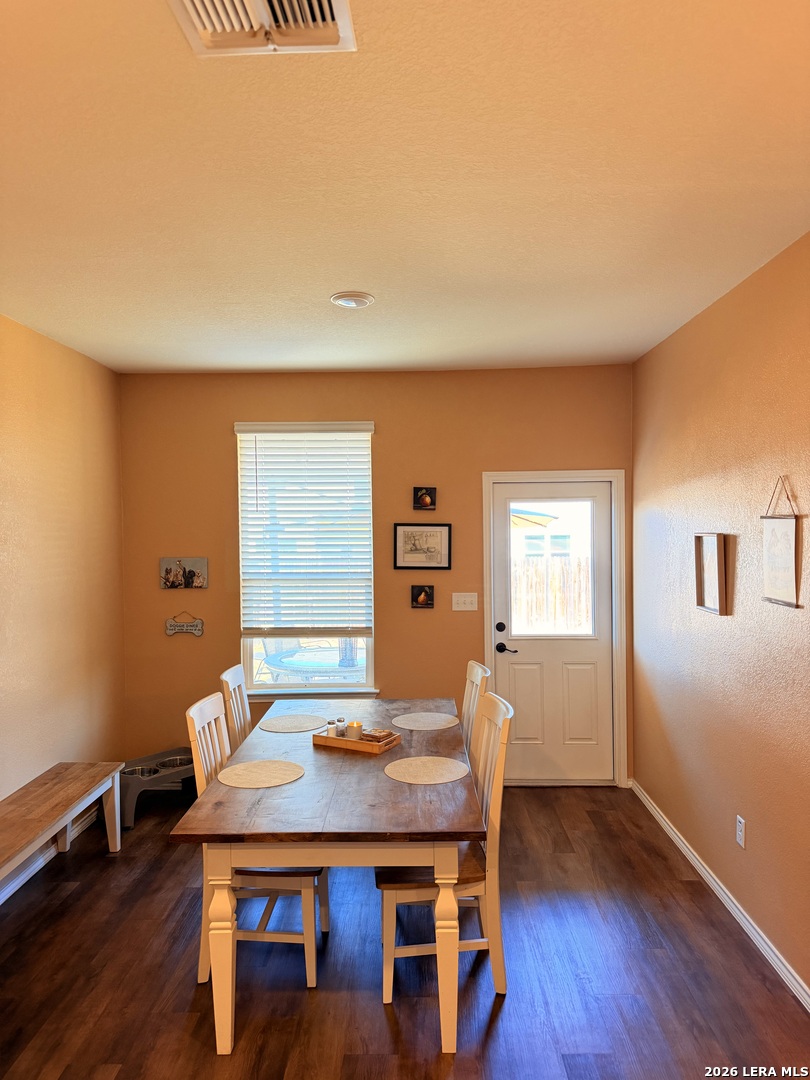 10255 Crossbuck Converse, TX 78109 - Photo 5 of 19 a view of a dining room with furniture and wooden floor