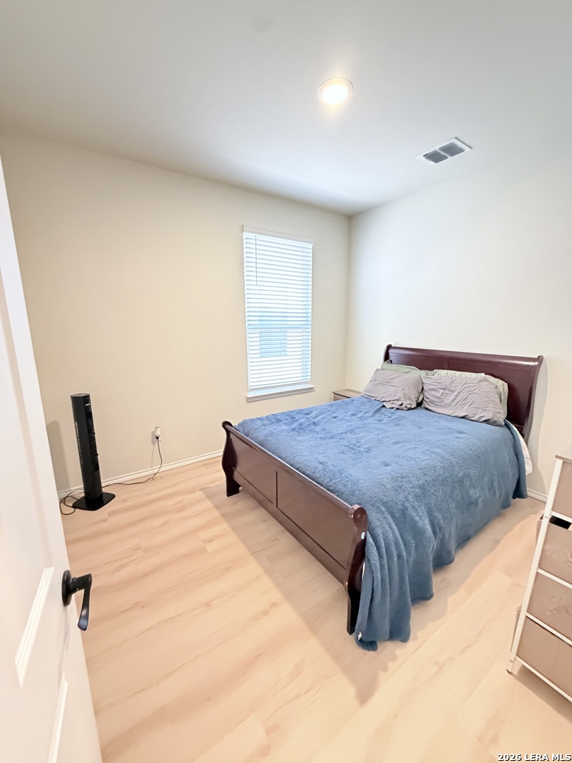 10255 Crossbuck Converse, TX 78109 - Photo 10 of 19 a bedroom with a bed and dresser