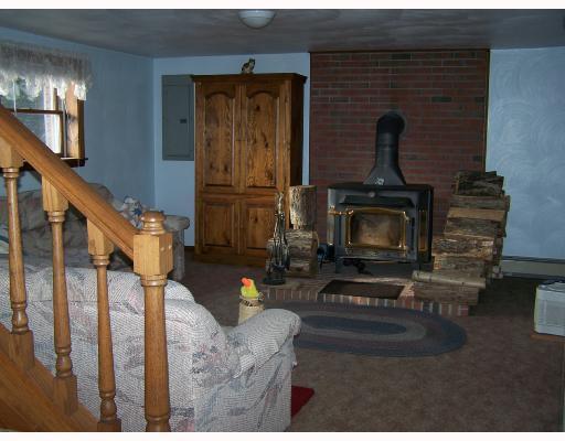 170 Lammert Road Indiana, PA 15701 - Photo 3 of 8 Den/Family/Great Room. Wood burner provides circulating heat that adds to the hot water baseboard oil heat of the home. So very cozy room with a half bath also.