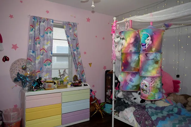 a view of a bedroom with baby toys