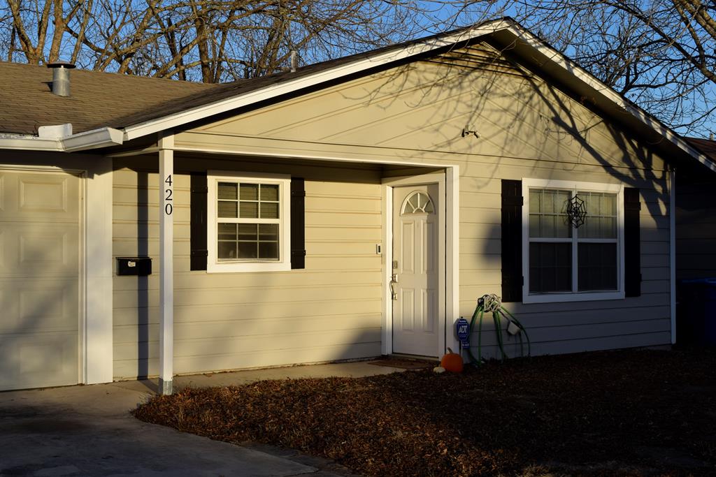 420 Bluebonnet Drive Kerrville, TX 78028 - Photo 2 of 22 a front view of a house with a yard