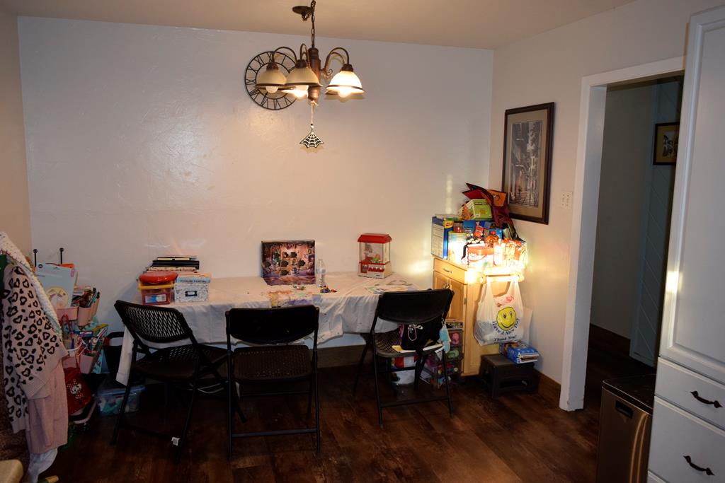 420 Bluebonnet Drive Kerrville, TX 78028 - Photo 10 of 22 a view of a dining room with furniture wooden floor and chandelier