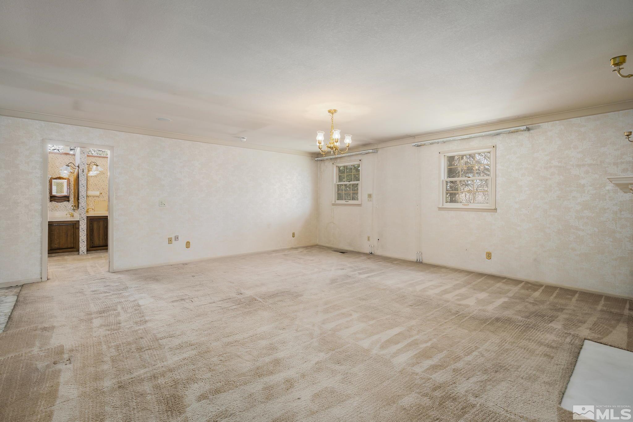 1545 Meadowview Lane Reno, NV 89509 - Photo 13 of 36 an empty room with windows and closet