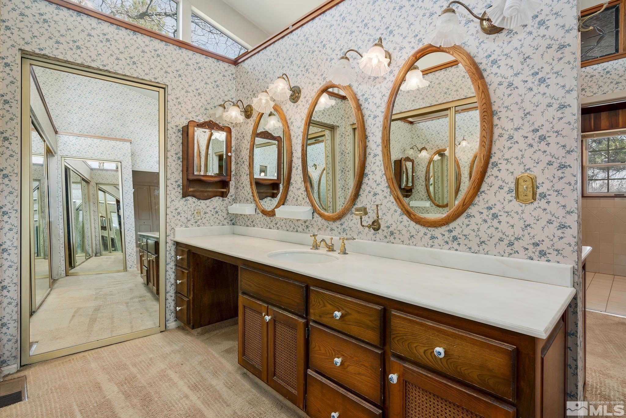 1545 Meadowview Lane Reno, NV 89509 - Photo 15 of 36 a bathroom with a granite countertop double vanity sink and a mirror