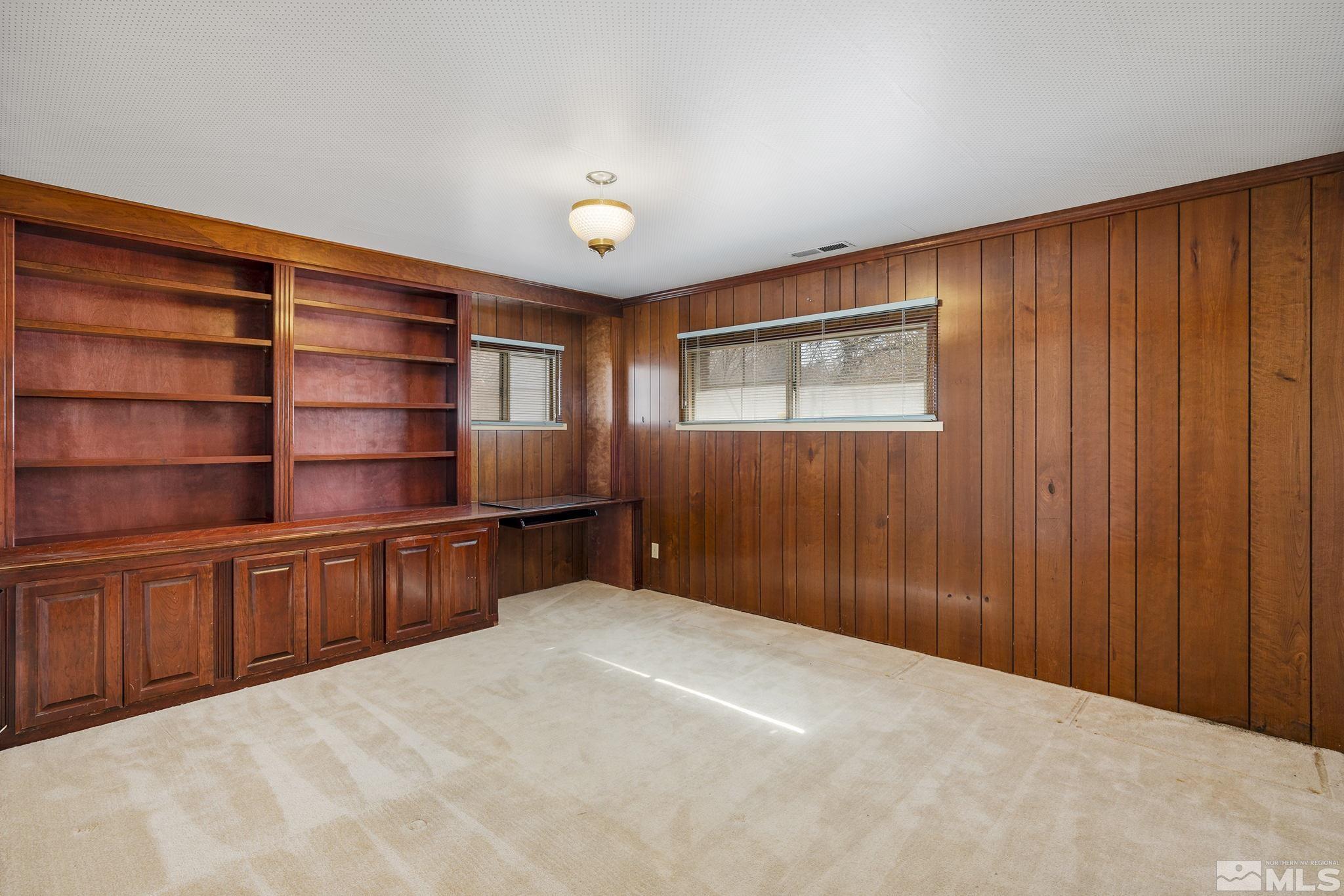 1545 Meadowview Lane Reno, NV 89509 - Photo 19 of 36 a room with closet and wooden shelves