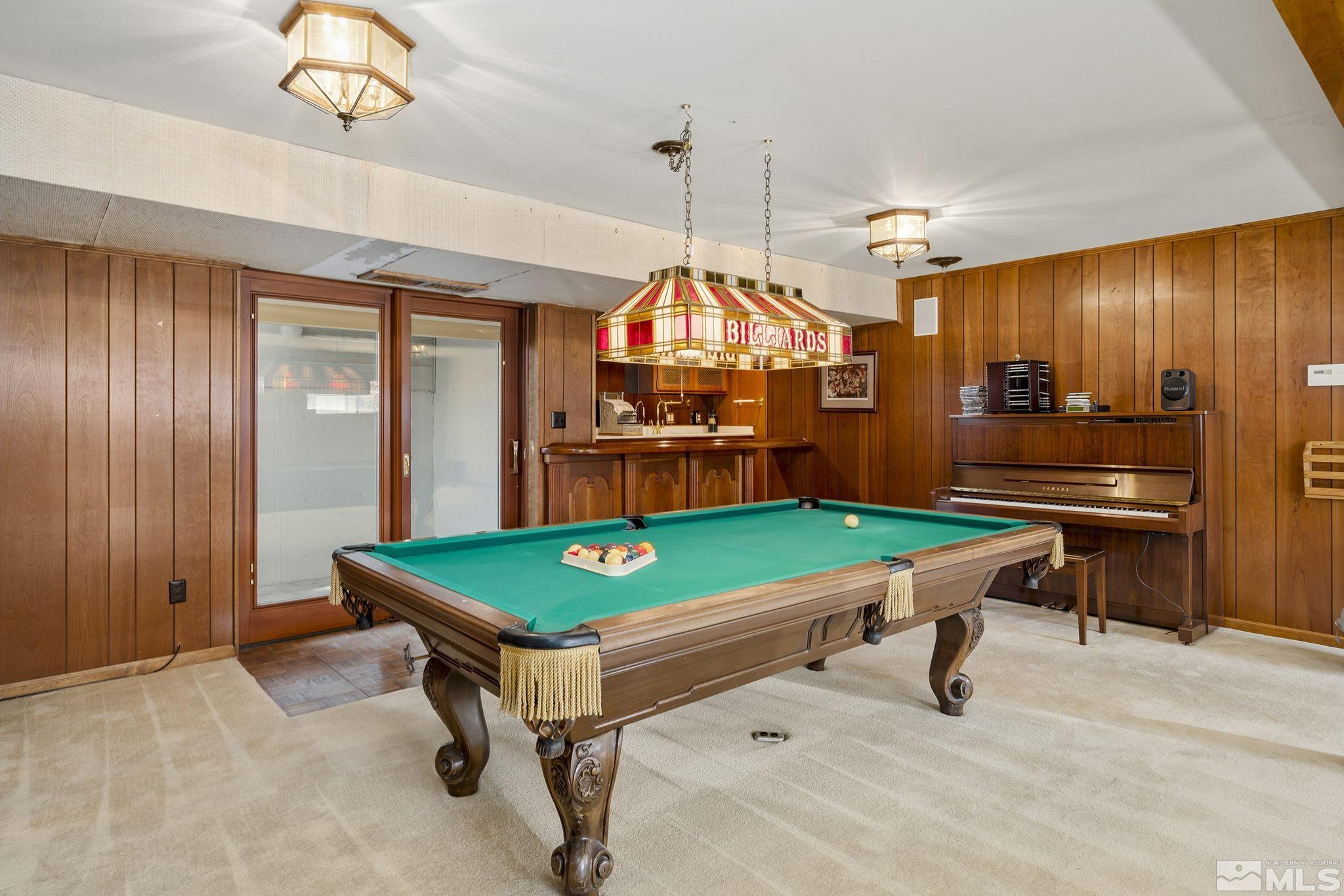 1545 Meadowview Lane Reno, NV 89509 - Photo 23 of 36 a room with pool table table tennis pool view and windows