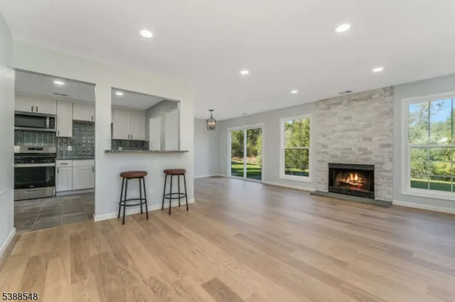 a view of kitchen with cabinets and wooden floor