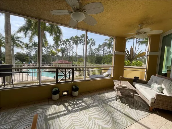 a very nice looking room with a large window and a table