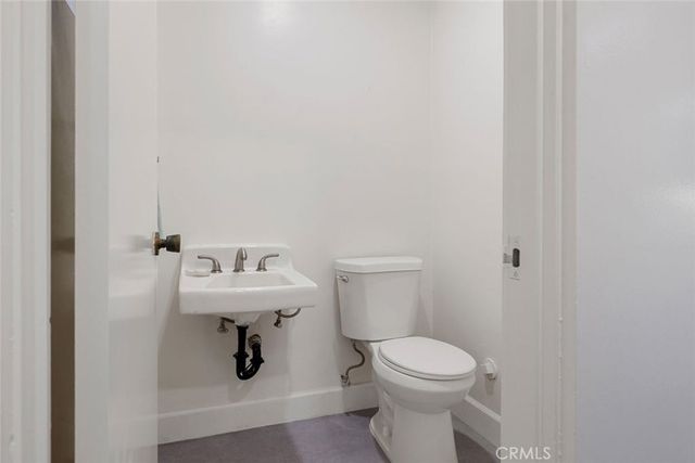 a white bath tub sitting in a en suite bathroom