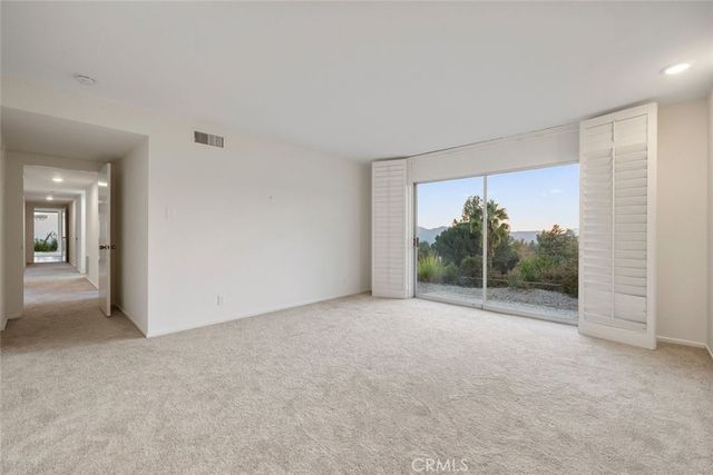 a view of a city with a mountain in the background