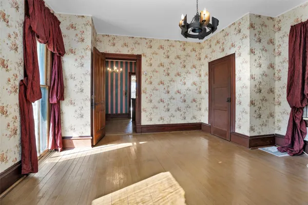 a view of a balcony with wooden floor and fence