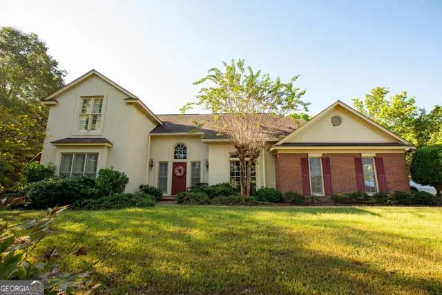 a front view of a house with garden