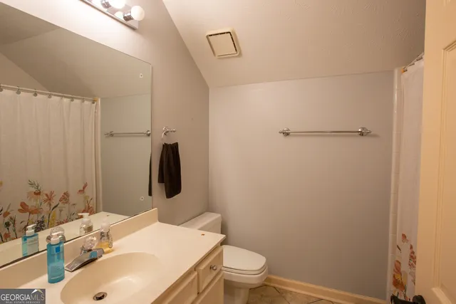 a backyard of a house with a yard with outdoor seating